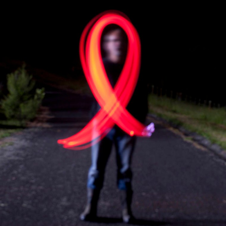 The red ribbon is the international symbol of HIV awareness.(© All Rights Reserved)