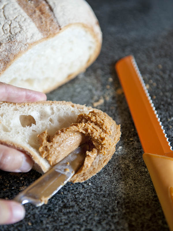 Pure peanut butter on a slice of freshly baked bread - comfort food delux.(© All Rights Reserved)