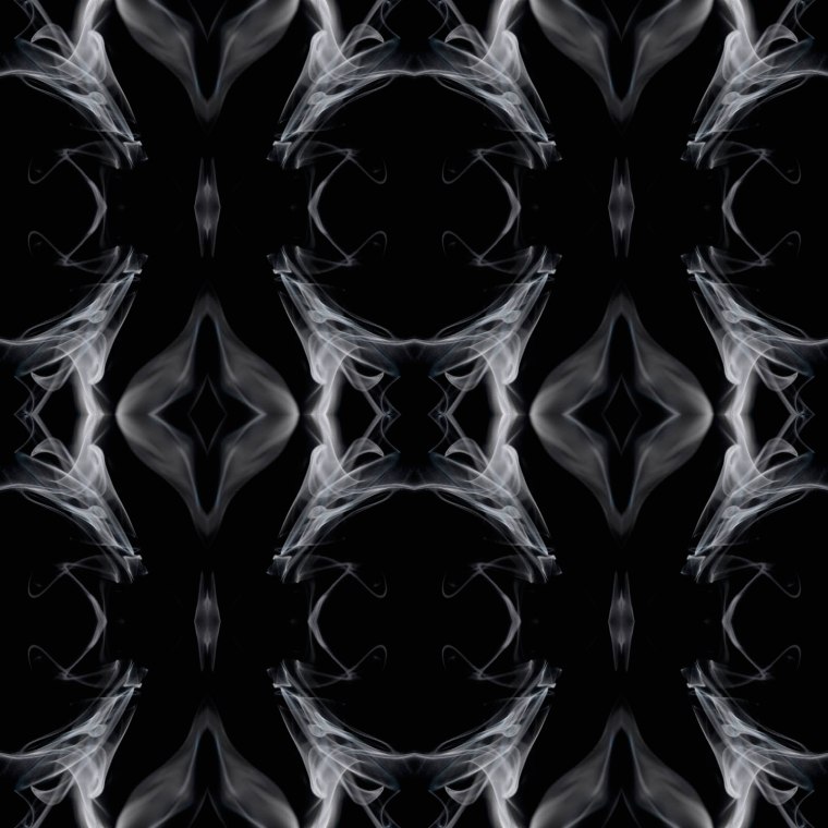 'Smoke and mirrors' - patterns created through repeated mirroring of candle smoke.(© All Rights Reserved)