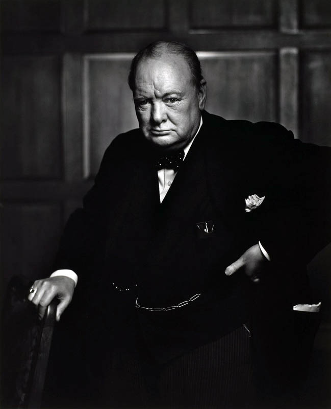 The famous 1941 Karsh portrait of Winston Churchill. According to legend, Karsh only had a few minutes to photograph the great man - quite a daunting prospect. When Churchill entered the room where the portrait was to be taken, he appeared in a fowl mood, seemingly less than keen on the photo shoot. This attitude actually suited Karsh, who relished the challenge to capture his subject's character in his photographs. However, he thought the fact that Churchill had a cigar stuck between his teeth wouldn't work in the portrait, so he instinctively reached out and removed the cigar. This really aggrevated Churchill - his scowl deepened, he thrust his head forward and he angrily placed his hand on his hip. Noticing that this was the perfect moment, Karsh took the picture, and immortalised Churchill in a pose of unconquerable defiance. Despite being difficult during the shoot, Churchill acknowledged Karsh's photographic mastery - he is quoted as saying "You can even make a roaring lion stand still to be photographed." This prompted Karch to title the portrait 'The Roaring Lion'.